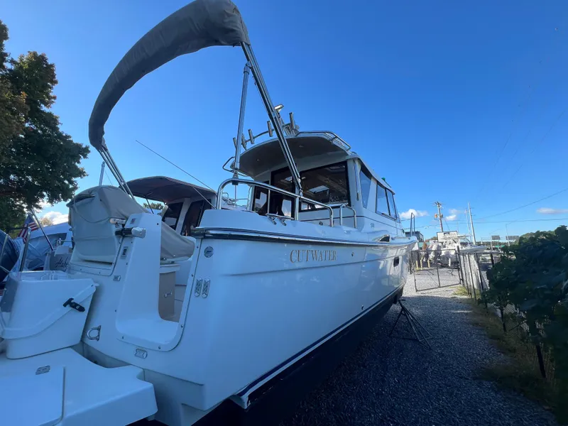 Slide: The Image of 2016 Cutwater C28 boat docked under clear blue sky. - 4