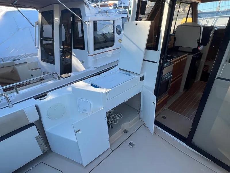 Slide: The Image of 2016 Cutwater C28 boat interior with open storage compartments and visible cockpit area. - 9