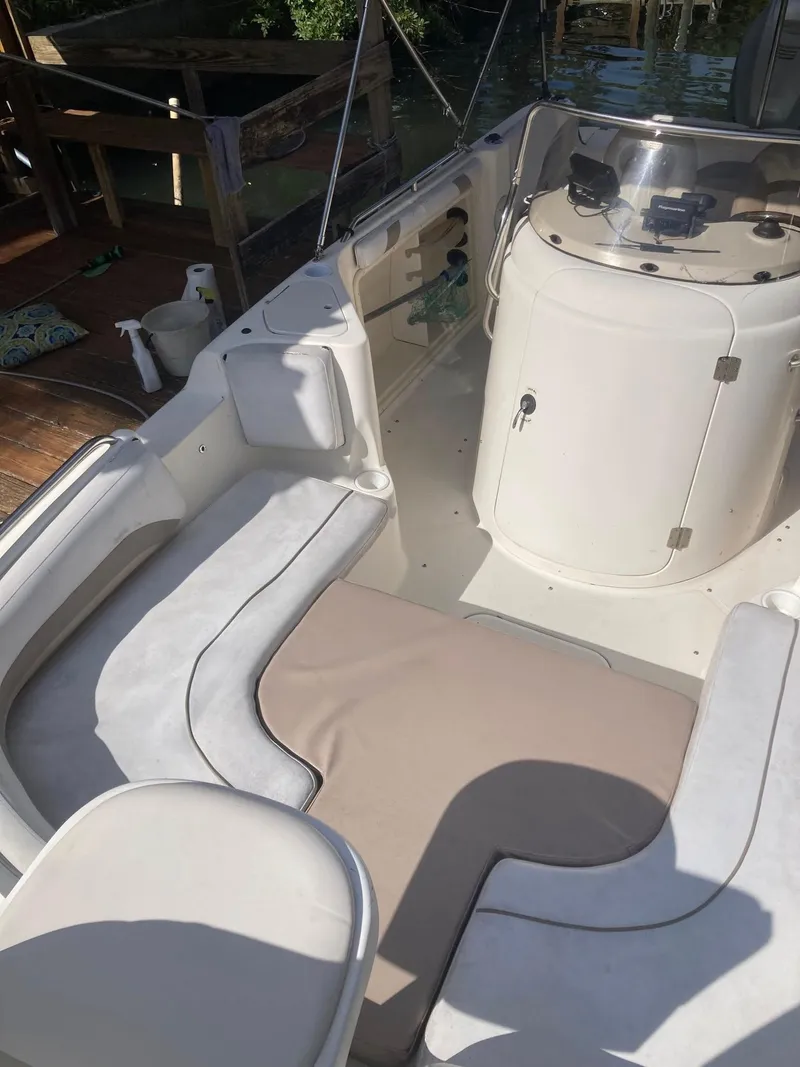Slide: The Image of 2002 Hurricane FunDeck 211 O/B boat interior with seating and helm. - 12