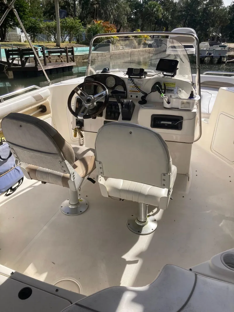 Slide: The Image of 2002 Hurricane FunDeck 211 O/B boat interior with dual seats and control panel. - 16