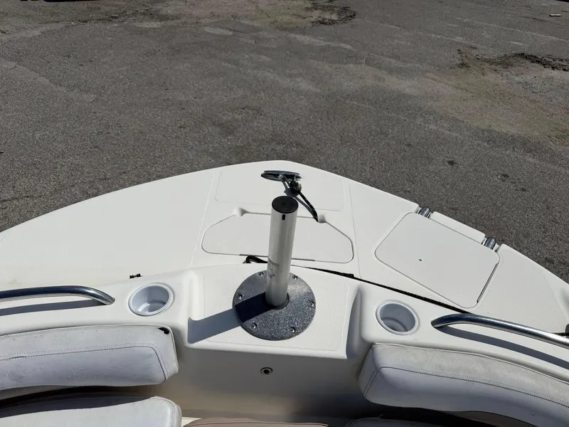 Slide: The Image of 2002 Hurricane FunDeck 211 O/B boat deck with seating and cup holders. - 25