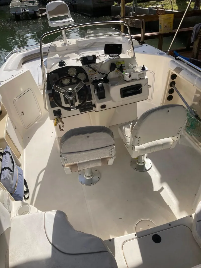 Slide: The Image of 2002 Hurricane FunDeck 211 O/B boat interior with dual seats and steering console. - 29