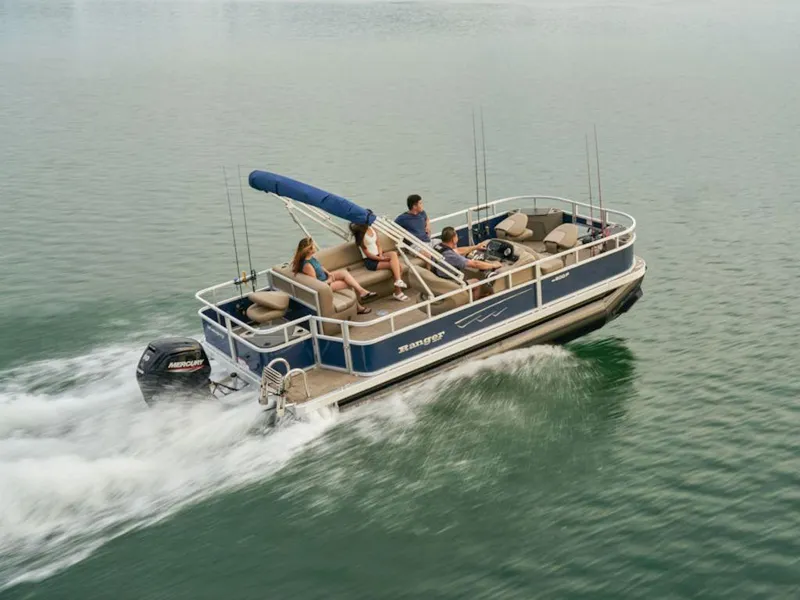 Slide: The Image of 2024 Ranger 200F pontoon boat cruising on a lake with passengers. - 14