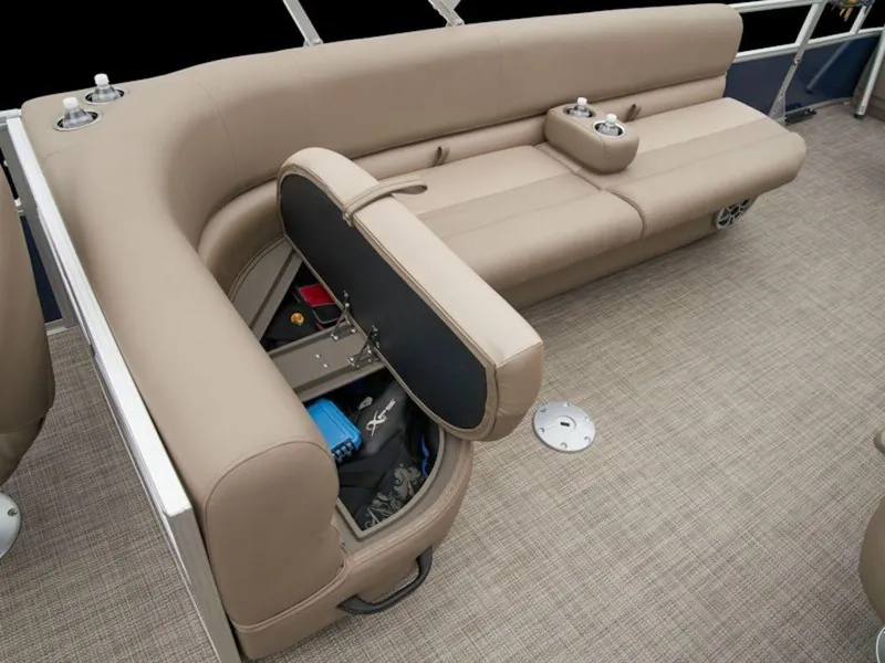 Slide: The Image of 2024 Ranger 200F boat interior with beige seating and storage compartment open. - 15