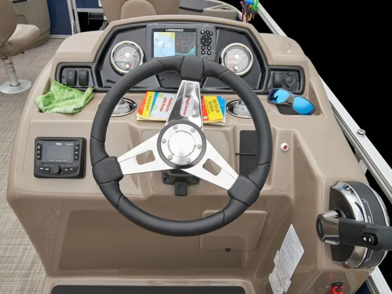 Slide: The Image of 2024 Ranger 200F boat dashboard with steering wheel, navigation system, and controls. - 2
