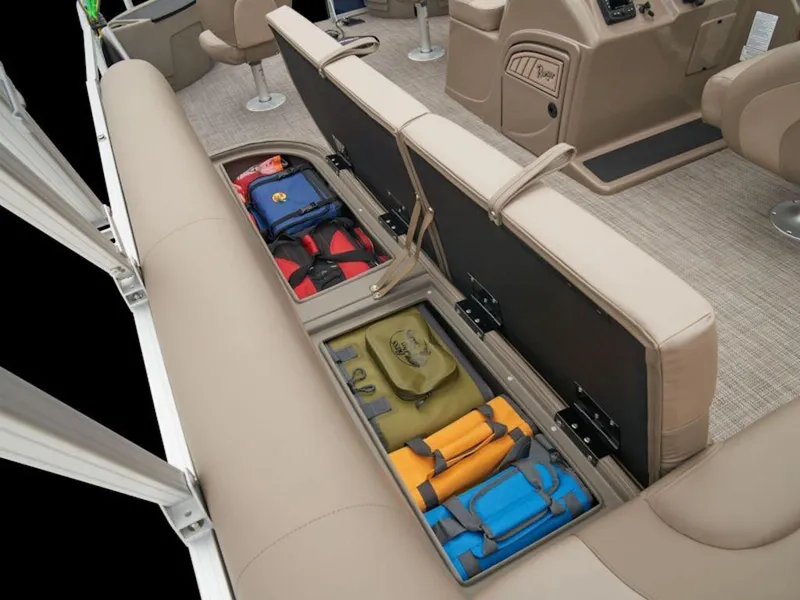 Slide: The Image of 2024 Ranger 200F boat interior with open storage compartments and colorful gear bags. - 3