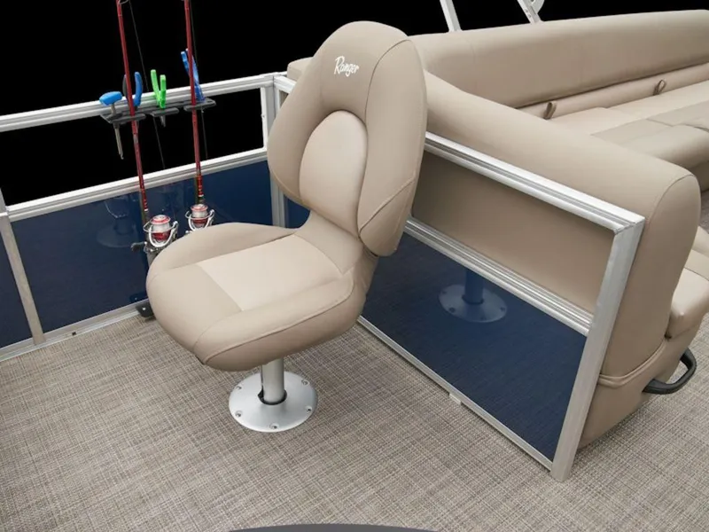 Slide: The Image of 2024 Ranger 200F boat interior with beige seating and fishing rod holders. - 7