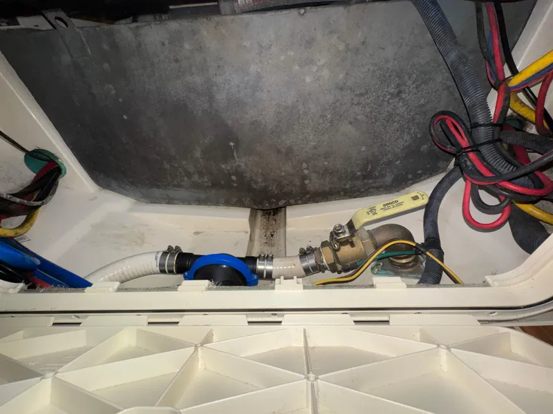 Slide: The Image of 2016 Scout 255 LXF boat wiring and plumbing components in the engine compartment. - 28