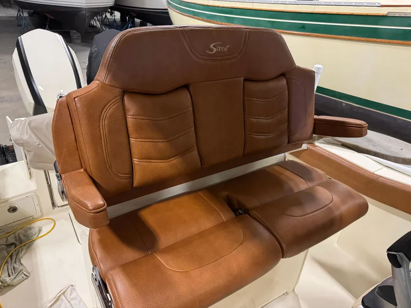 Slide: The Image of 2016 Scout 255 LXF boat seat with brown leather upholstery. - 32