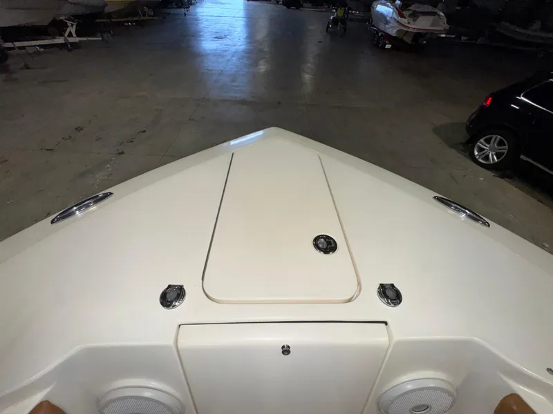Slide: The Image of Bow view of 2016 Scout 255 LXF boat in indoor storage. - 42