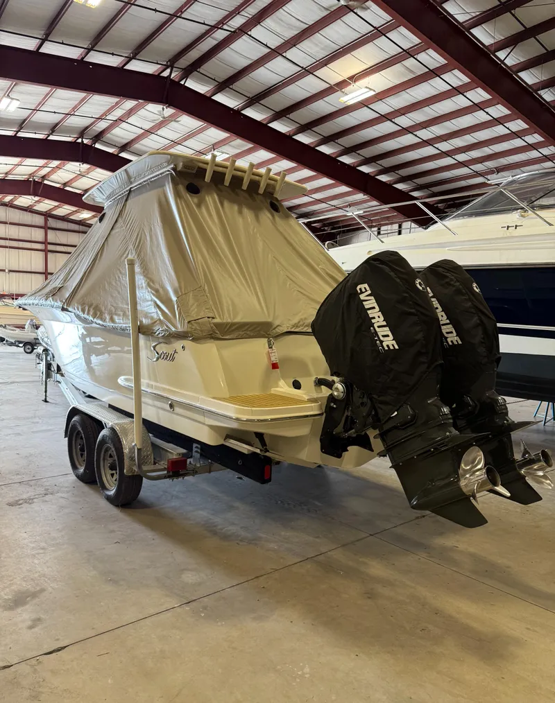 Slide: The Image of 2016 Scout 255 LXF boat with Evinrude engines in a storage facility. - 6