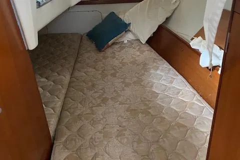 Slide: The Image of Interior cabin of 2006 Beneteau Oceanis Clipper 323 with bed and pillows. - 9