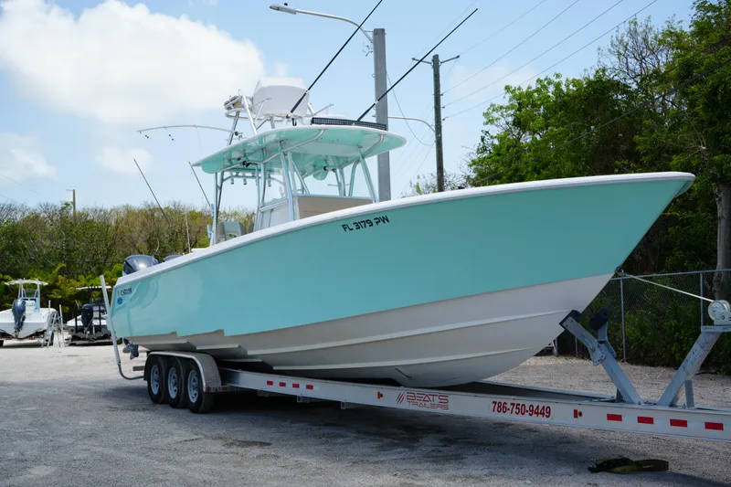 The Image of 2015 Contender 39 ST boat on clear water under blue sky. - 0
