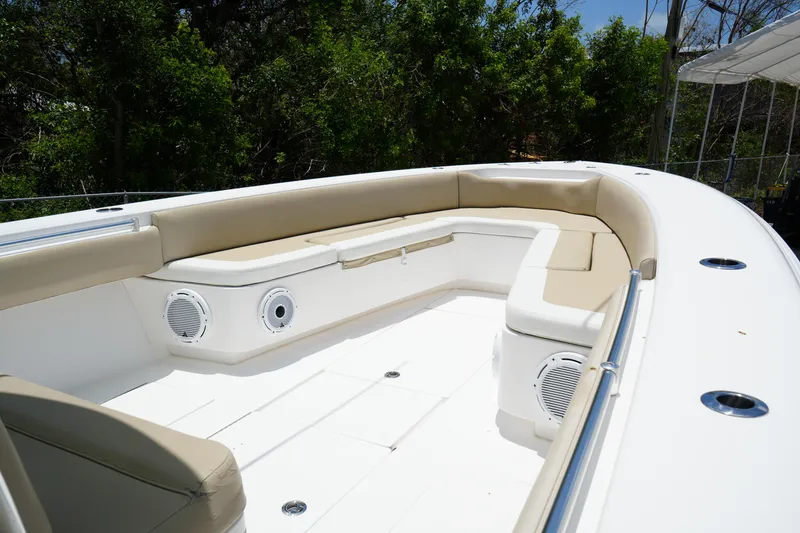 Slide: The Image of 2015 Contender 39ST boat interior with beige seating and built-in speakers. - 4