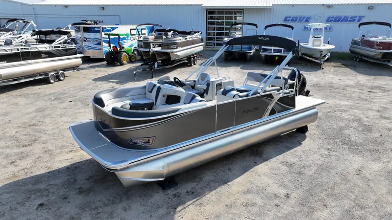 The Image of 2025 Avalon LSZ Cruise Rear Bench pontoon boat displayed at Cove Coast Marine dealership. - 0