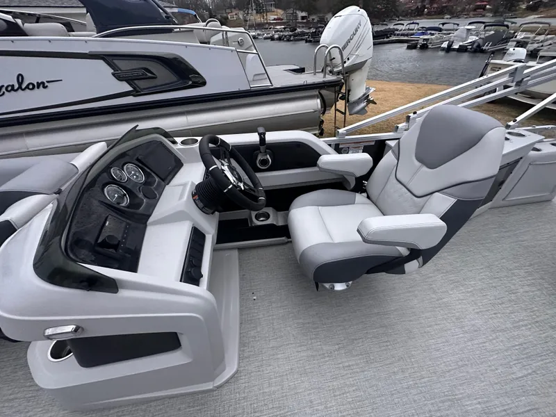 Slide: The Image of 2025 Avalon LSZ Cruise Rear Bench boat interior with modern helm and comfortable seating. - 8