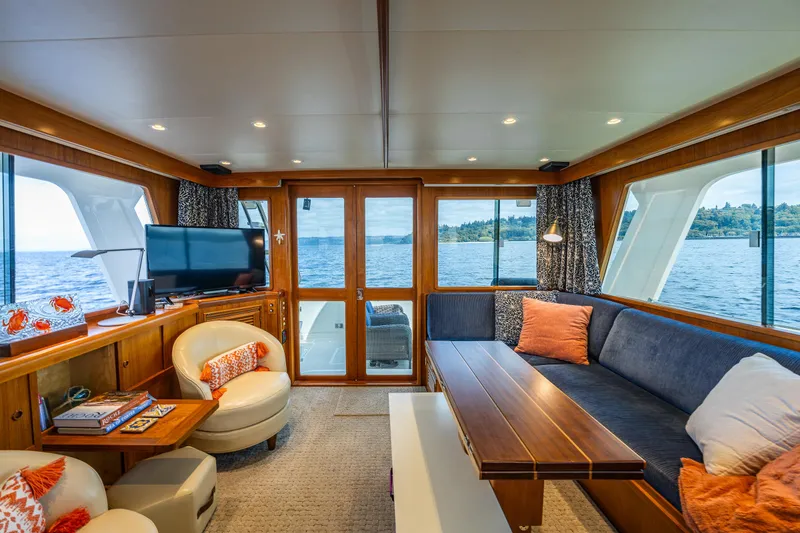 Slide: The Image of Luxurious interior of 1997 Offshore Yachts 52 Sedan with elegant seating and scenic ocean views. - 12