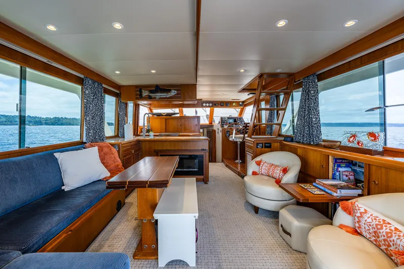 Slide: The Image of Luxurious interior of 1997 Offshore Yachts 52 Sedan with elegant wood finishes and comfortable seating. - 14