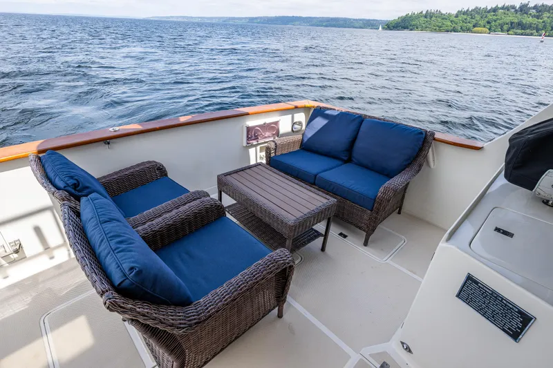 Slide: The Image of Outdoor seating on 1997 Offshore Yachts 52 Sedan, overlooking serene water. - 37