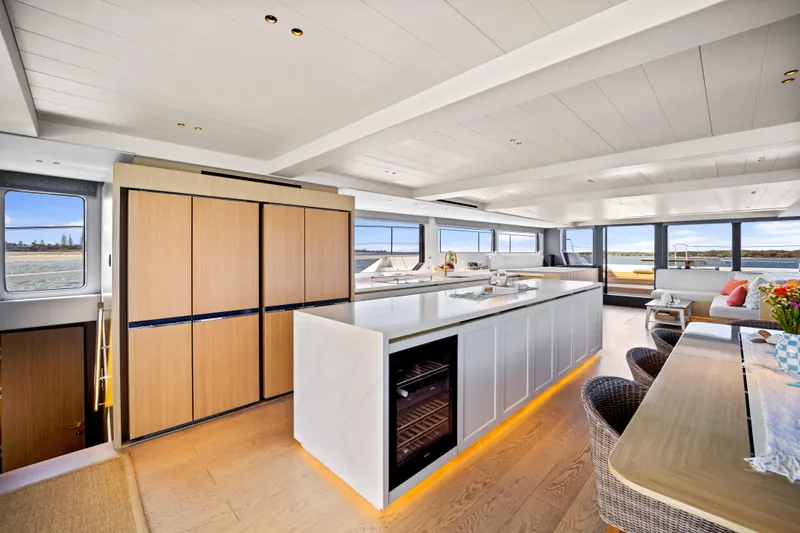 Slide: The Image of Luxurious interior of 2026 McConaghy 82P yacht with modern kitchen and panoramic windows. - 12