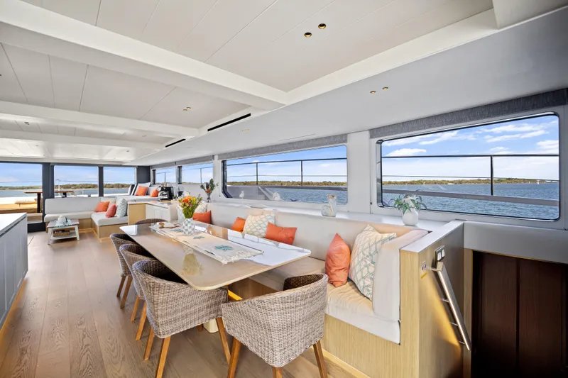 Slide: The Image of Luxurious interior of 2026 McConaghy 82P yacht with elegant dining area and panoramic windows. - 15
