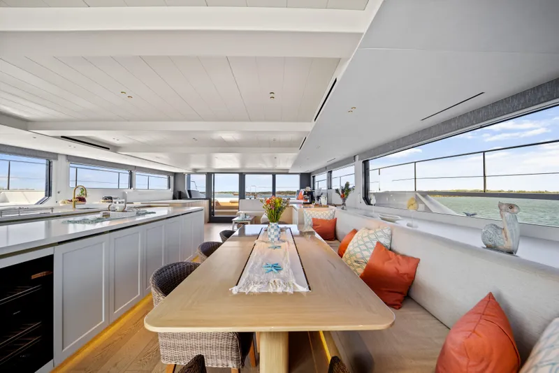 Slide: The Image of Luxurious interior of 2026 McConaghy 82P yacht with modern dining area and panoramic windows. - 16