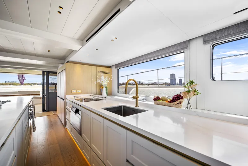 Slide: The Image of Luxurious kitchen interior of 2026 McConaghy 82P yacht with modern design and large windows. - 29
