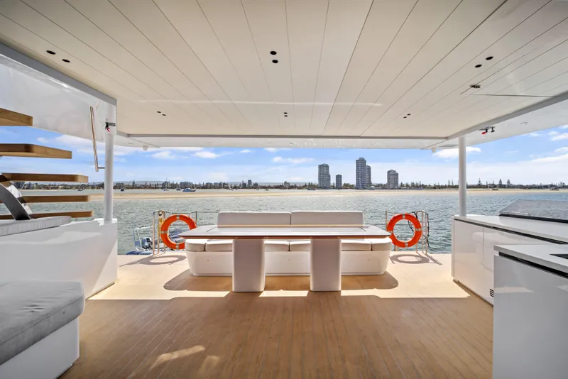 Slide: The Image of Luxurious McConaghy 82P yacht interior with ocean view, featuring modern seating and sleek design, 2026 model. - 31