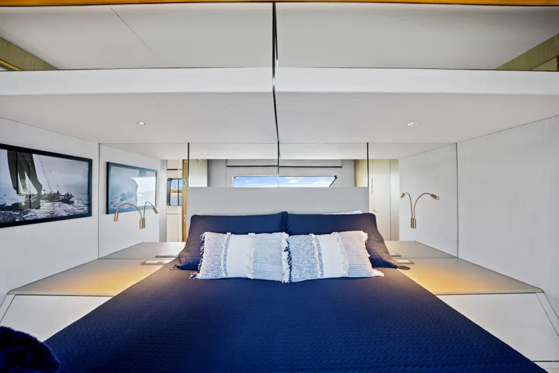 Slide: The Image of Luxurious bedroom interior of 2026 McConaghy 82P yacht with modern design and blue bedding. - 40