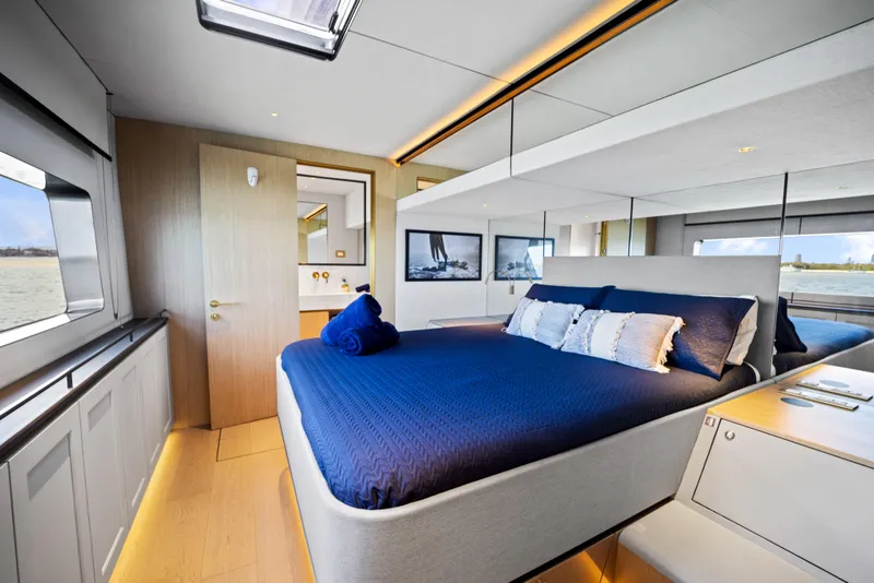 Slide: The Image of Luxurious bedroom interior of 2026 McConaghy 82P yacht with modern design and blue bedding. - 41