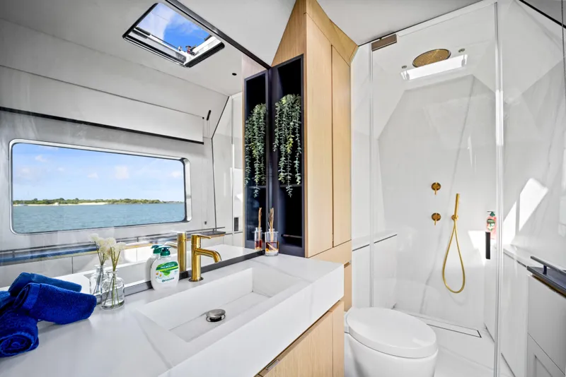 Slide: The Image of Luxurious bathroom in 2026 McConaghy 82P yacht with modern fixtures and ocean view. - 44