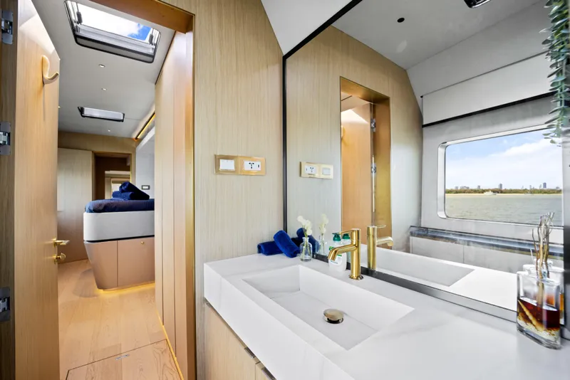 Slide: The Image of Luxurious bathroom interior of 2026 McConaghy 82P yacht with modern fixtures and scenic window view. - 45