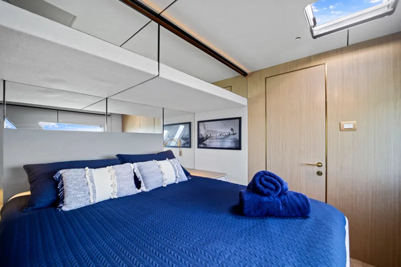 Slide: The Image of Luxurious bedroom in 2026 McConaghy 82P yacht with blue bedding and modern decor. - 46