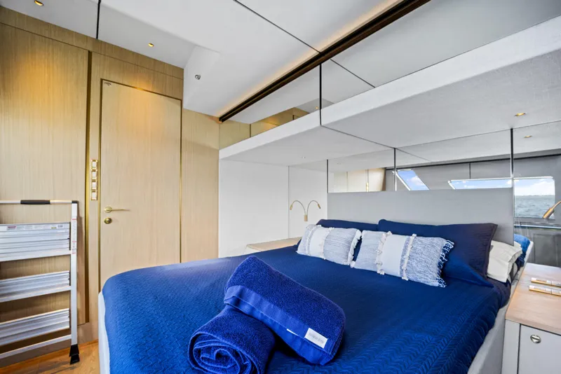 Slide: The Image of Luxurious bedroom interior of 2026 McConaghy 82P yacht with modern design and blue bedding. - 47