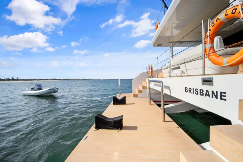 Slide: The Image of Luxury McConaghy 82P yacht docked, featuring spacious deck and lifebuoy, 2026 model. - 49