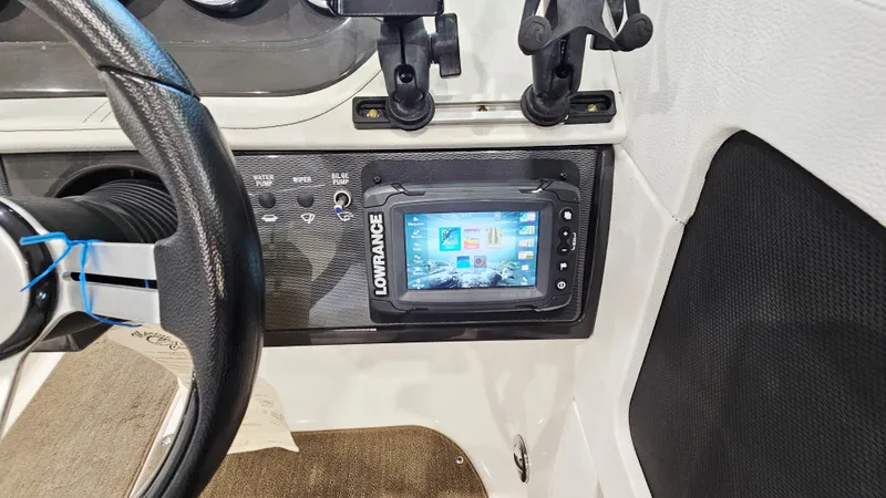 Slide: The Image of 2014 Sea Ray 220 Sundeck Outboard dashboard with Lowrance navigation system. - 13