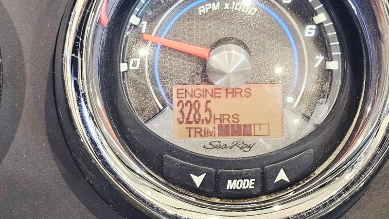 Slide: The Image of Dashboard of 2014 Sea Ray 220 Sundeck Outboard showing 328.5 engine hours. - 27