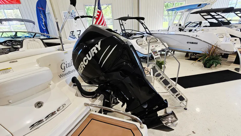 Slide: The Image of 2014 Sea Ray 220 Sundeck Outboard with Mercury engine in showroom display. - 29