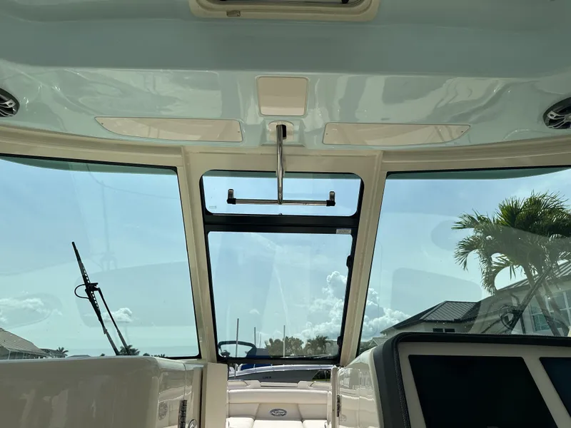 Slide: The Image of Interior view of 2023 Grady-White Freedom 325 boat, showcasing windshield and dashboard. - 18