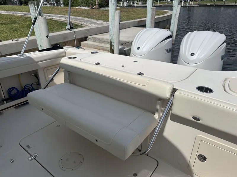 Slide: The Image of 2023 Grady-White Freedom 325 boat with Yamaha engines, featuring a foldable bench seat. - 9