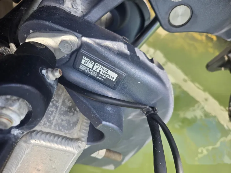 Slide: The Image of Close-up of a Yamaha F175XA engine part on a 2019 Bennington ETW boat. - 11