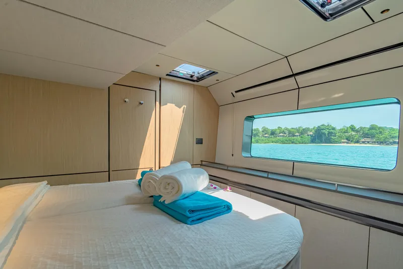 Slide: The Image of Luxurious cabin interior of 2026 McConaghy MC75 yacht with scenic ocean view. - 12