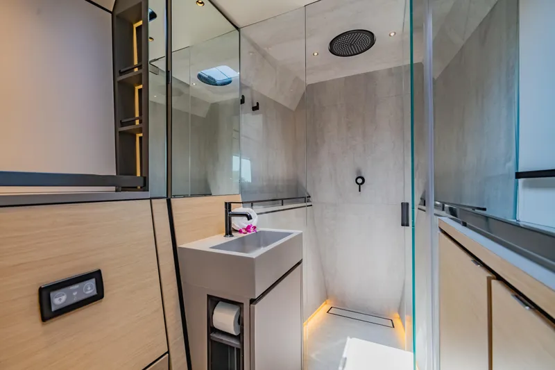 Slide: The Image of Luxurious bathroom in 2026 McConaghy MC75 yacht with modern fixtures and elegant design. - 14
