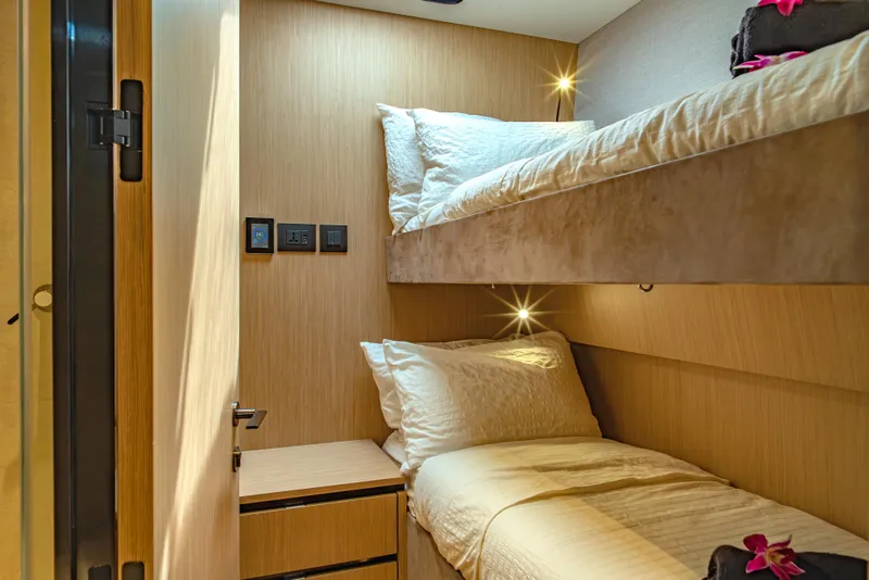 Slide: The Image of 2026 McConaghy MC75 yacht interior with cozy bunk beds and modern lighting. - 17