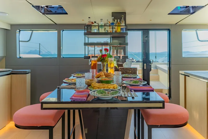 Slide: The Image of Luxurious dining area on 2026 McConaghy MC75 yacht with elegant table setting and ocean view. - 22