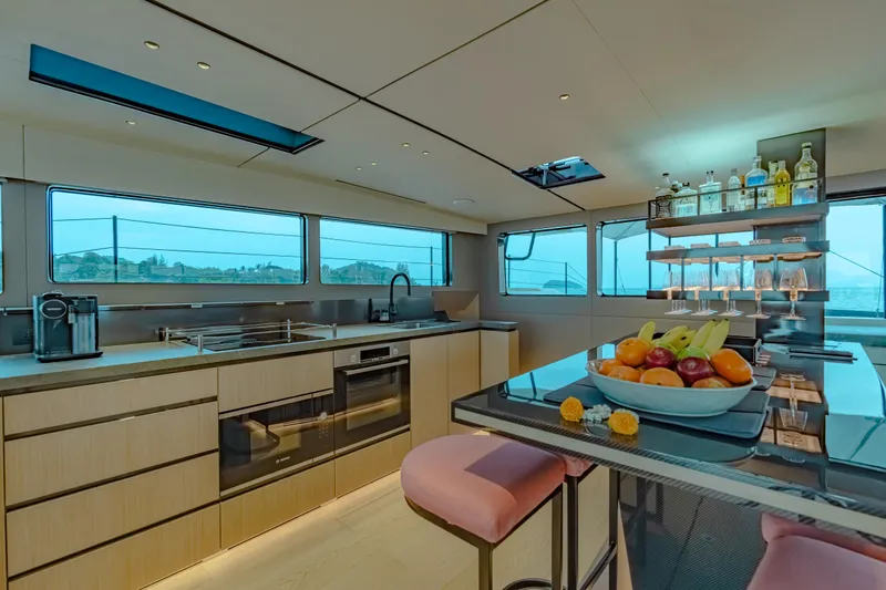 Slide: The Image of Luxurious McConaghy MC75 yacht kitchen interior, featuring modern appliances and elegant dining area, 2026 model. - 6