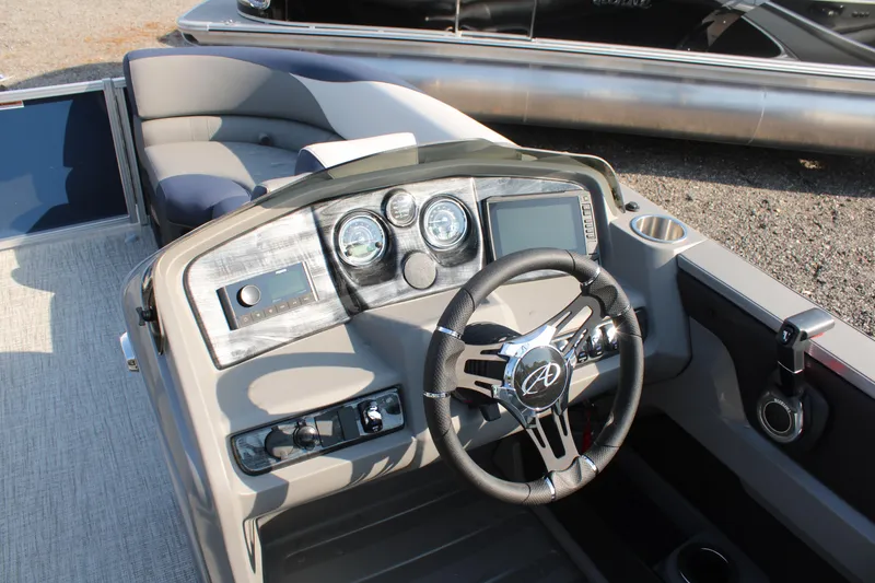 Slide: The Image of 2024 Avalon LSZ Quad Lounger dashboard with steering wheel and control panel. - 15