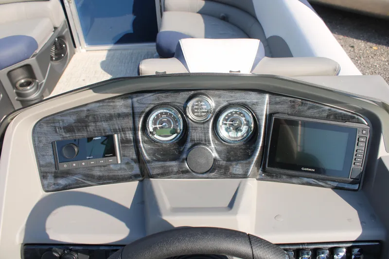 Slide: The Image of Dashboard of 2024 Avalon LSZ Quad Lounger with gauges and navigation screen. - 16