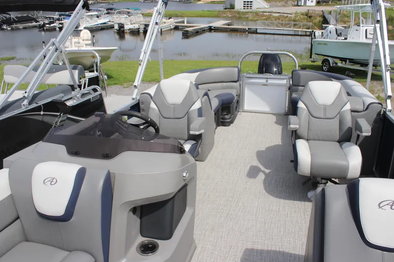 Slide: The Image of 2024 Avalon LSZ Quad Lounger pontoon boat with luxurious seating and modern design. - 2