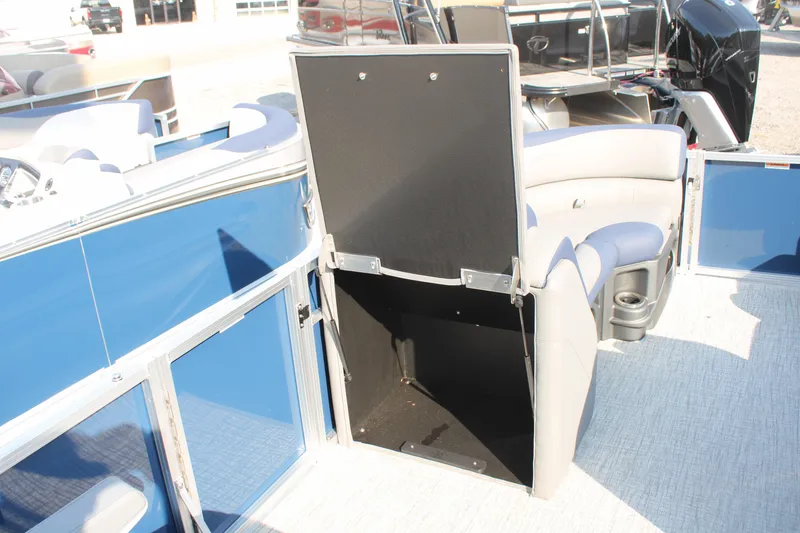 Slide: The Image of 2024 Avalon LSZ Quad Lounger boat interior with open storage compartment. - 20